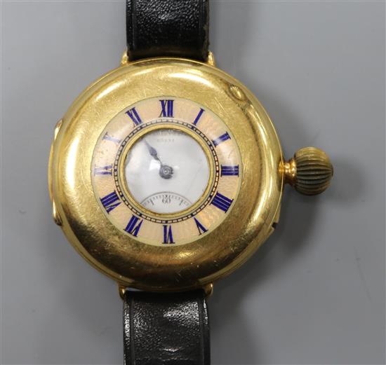 An 18ct gold half hunter wrist watch by Ashley & Sims, Clerkenwell, on leather strap.